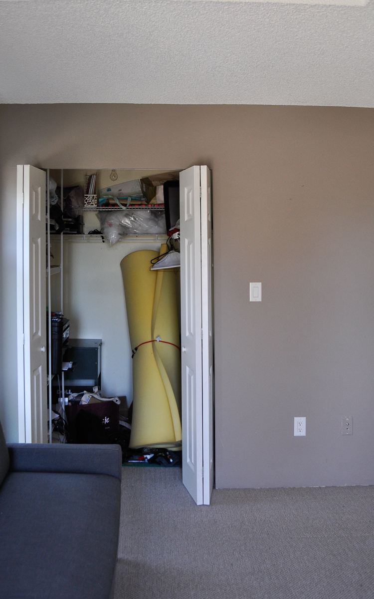 The unorganized closet before reveal